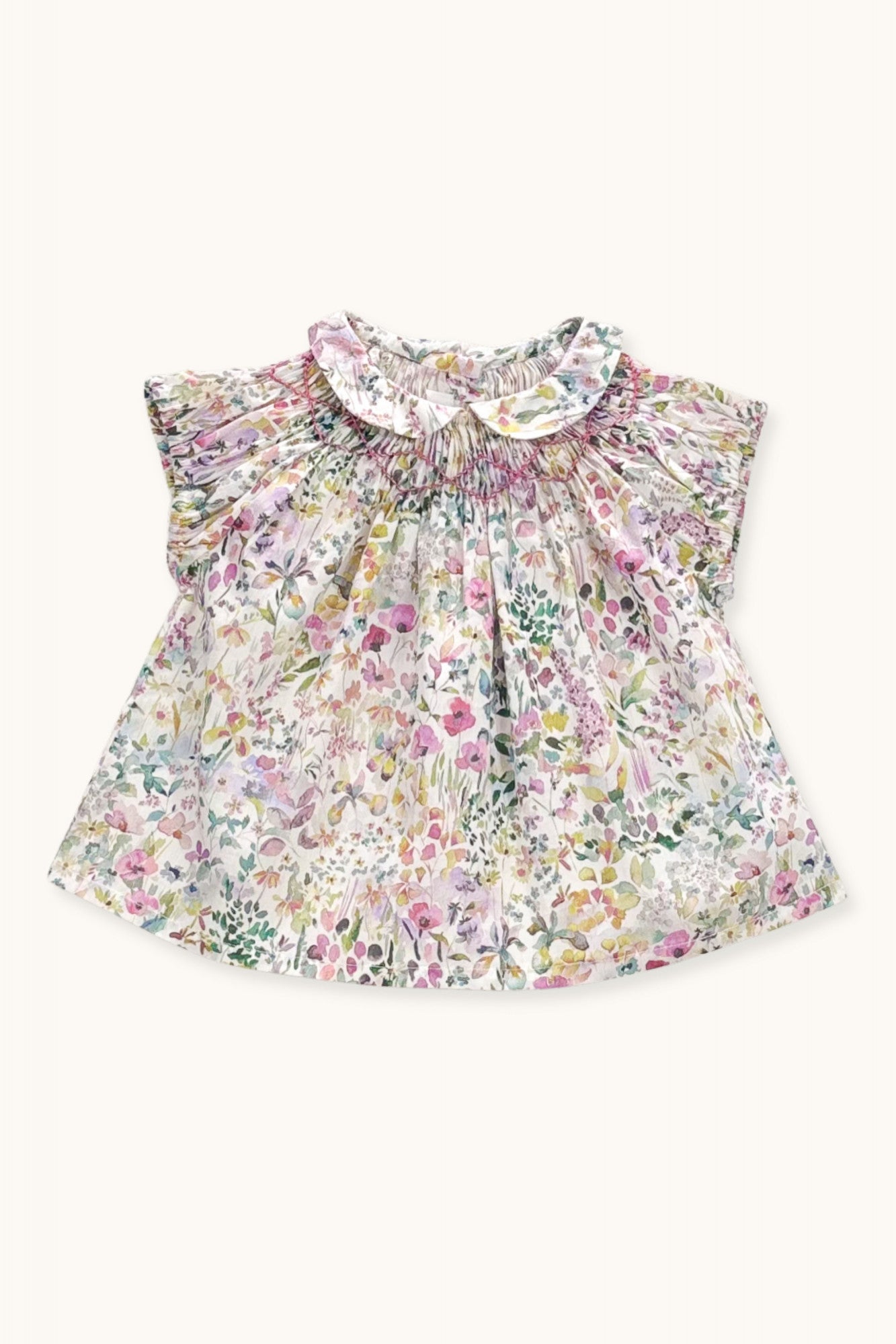 Pirouette baby blouse hand-smocked in Liberty